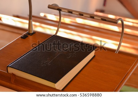 A Holy Bible on a pulpit in a church waiting for the preacher or pastor 
