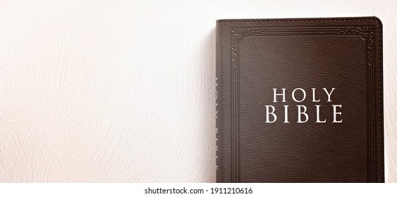 The Holy Bible On A Textured White Surface