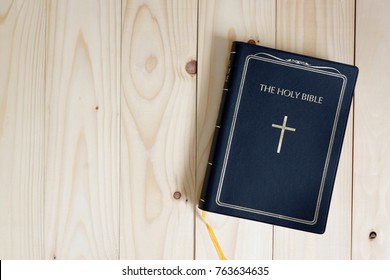 Holy Bible On Wood Table