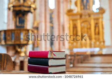 Holy bible on a wooden church bench, selective focus
