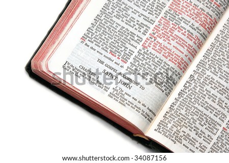 holy bible open to the gospel according to saint john, against a white background