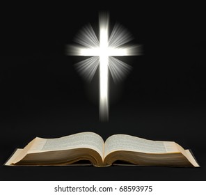 Holy bible with shining cross over black background