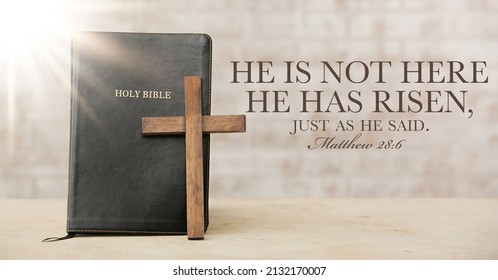 Holy Bible with wooden cross on light background