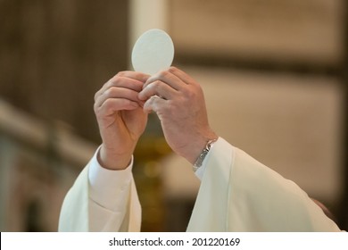The holy bread of the Communion during the Mass - Shutterstock ID 201220169