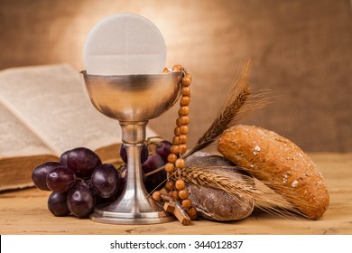 holy communion chalice on wooden table - Shutterstock ID 344012837