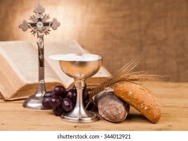 holy communion chalice on wooden table - Shutterstock ID 344012921