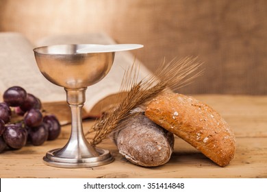 holy communion chalice on wooden table - Shutterstock ID 351414848