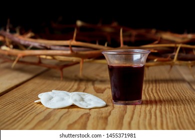 Holy Communion, a Cup of Wine and Bread with a Jesus Crown Thorn and Holy Bible.