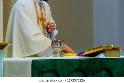 Holy communion on table in church and Holy Bible cup of glass with red wine - Shutterstock ID 1172376226