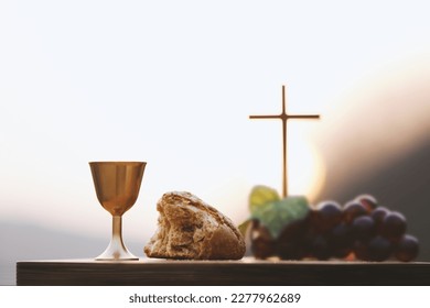 Holy Communion, which symbolizes the holy blood and flesh of Jesus Christ. The Last Supper. Bread, wine, the Bible, the Holy Grail, and the cross. The background of the Lent Passion Week. Easter conce