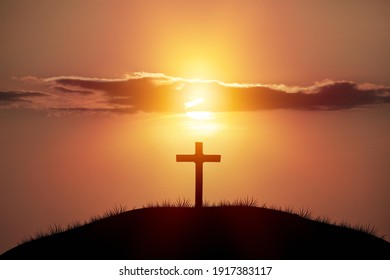 Holy concept: Silhouette wooden cross on  mountain sunset background