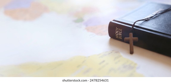 Holy cross of Jesus Christ, Bible book, world map background and mission, gospel and evangelism concept
