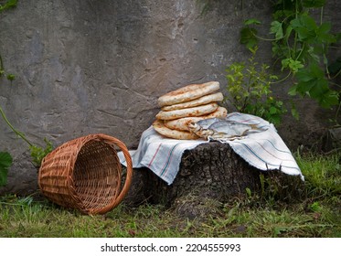 Holy fresh raw simple rural box barley pita cake bakery Lord pray bless retro age Israel sign story. Closeup view jew towel cloth catholic supper still life outdoor stone garden wall field text space - Shutterstock ID 2204555993