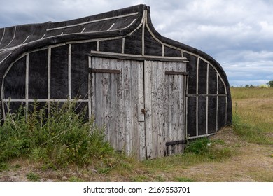 The Holy Island of Lindisfarne: June 19th, 2022: Distinctive boat turned into a shed at the harbour.