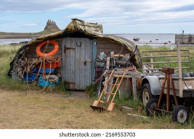 The Holy Island of Lindisfarne: June 19th, 2022: Distinctive boat turned into a shed at the harbour.