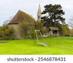 Holy Spirit Church, Rye Harbour, East Sussex, England, built in local blue stone and Caen stone 1849 in gothic revival style. Designed by Samuel Sanders Teulon. Extended in Arts  Crafts style 1912.