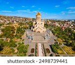 Holy Trinity Cathedral or Tsminda Sameba Church aerial panoramic view in Tbilisi old town. Tbilisi is the capital and the largest city of Georgia, lying on the banks of the Kura River.