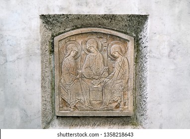 Holy Trinity holiday. pentecost sunday. old tombstone, stone carving icon of Holy Trinity. divine Trinity, Orthodox christian church symbol. image of angels.