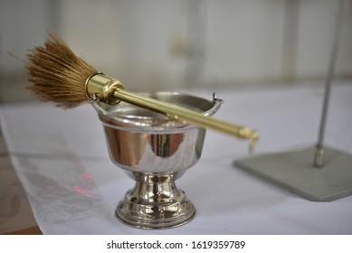 Holy water brush on altar