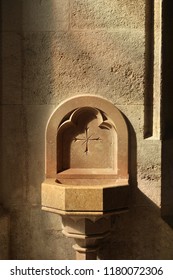                                
Holy water font at the entrance of the Church.