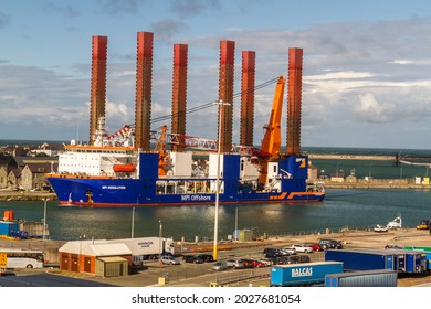 Holyhead, Wales – October 6 2020: Wind Turbine Installation Vessel (WTIV) Specifically Designed For The Installation Of Offshore Wind Turbines, Landscape