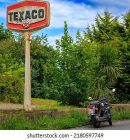 Holywood, County Down, Northern Ireland - July 13th 2022:  This is a Vintage Moto Guzzi T3 California at an Abandoned  Texaco Petrol Station