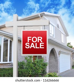 A Home Is Advertising A For Sale Sign On A Wooden Sign Post In Red. Use It For A Housing Market Concept.