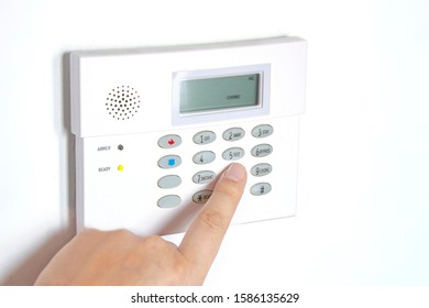 Home Alarm Panel To Control Security System With A Person's Hand