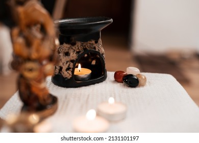 A Home Altar For Meditation And Prayer With Candles And An Aroma Lamp