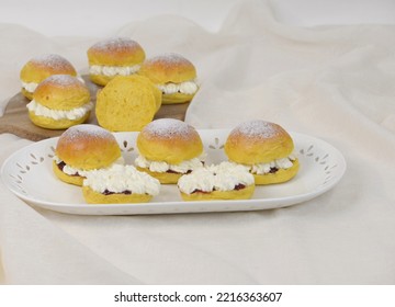 Home Baked Bread Cakes With Cheese. Cheesecakes With Pumpkin Buns Sliced And Stuffed With Creamy Cheese And Sprinkled With Sugar Powder. Sweet Sandwich Breads. Brioche With Soft Yellow Crumb.