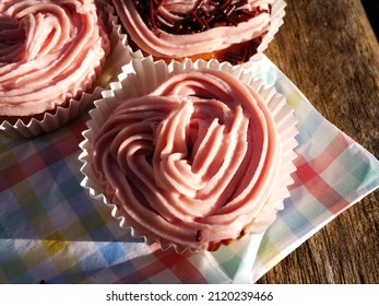 Home Baked Cupcake Decorated With Pink Frosting Close Up Shot Overhead Selective Focus 