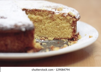 A Home Baked Lemon Drizzle Cake With A Slice Missing