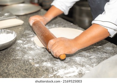 home bakery. Confectioner rolling gingerbread dough with rolling pin.People cooking food