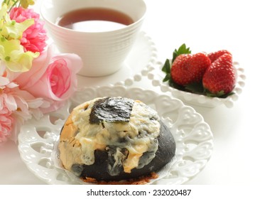 Home Bakery Squid Ink And Cheese Bread With Laver On Top For Fusion Food Image