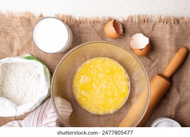 Home Baking - whisking eggs for homemade cake. Recipe with eggs, wholegrain flour, sugar and kefir. - Powered by Shutterstock