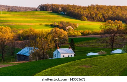 Home and barn on the farm fields and rolling hills of Southern York County, Pennsylvania.