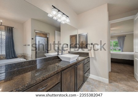 a home bathroom with a tub 