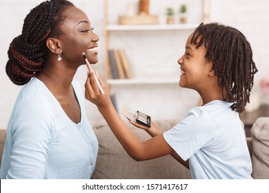 Home Beauty Salon Concept. Close-up Of Afro Girl Doing Makeup For Mom, Smiling And Spending Time Together.
