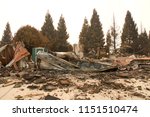 home burned to the ground in the recent wild fire fire storm in Redding, California. Smoke and ash in the air as the fire continues to burn several miles away.