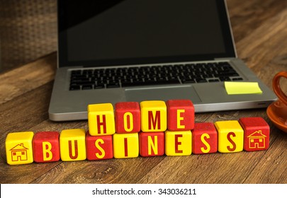 Home Business Written On A Wooden Cube In A Office Desk