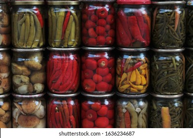 Home Canning Vegetables And Mushrooms In Glass Jars