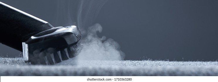 Home Cleaning. Steam Carpet Cleaning On A Grey Background. Photo From Copy Space.