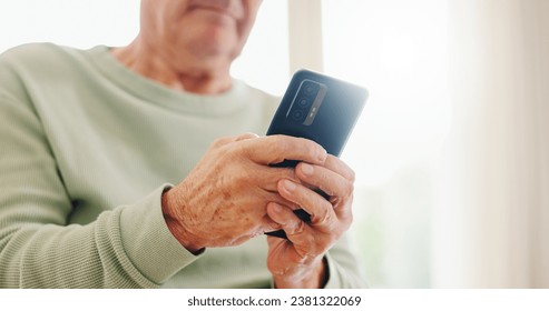 Home, closeup and senior hands with a cellphone, typing and connection with social media, digital app and contact. Old man, pensioner or mature guy with a smartphone, mobile user and search internet - Powered by Shutterstock