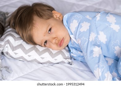 Home, Comfort, Childhood, Insomnia, Sleeplessness, Sweet Dream- Little Sad Authentic Toddler Sibling Kid Child Boy In Pajamas Lie Rest Cant Sleep On Bed Pillows With Open Eyes Soft Cozy Sleepy Mood