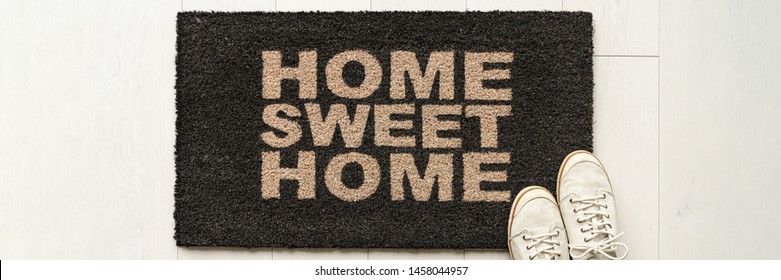 Home Condo Door Mat Sweet Home Doormat Text At Condo Entrance With Casual Shoes Panoramic Banner. House Move In Concept.