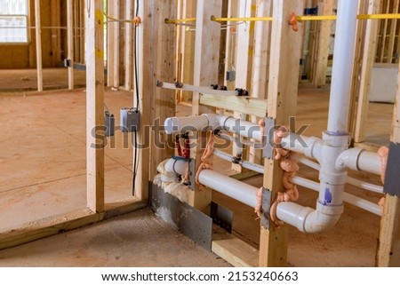 Home construction with hot red and cold blue pex pipe layout in new bathtub house PVC waste water system