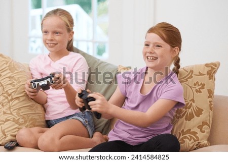 Similar – happy child playing video games with gamepad at home