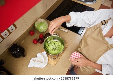 Home cook preparing fresh salad in a cozy kitchen - Powered by Shutterstock