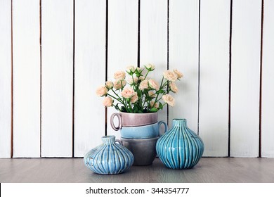 Home Decor And Roses On Wooden Background