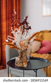 Home Decoration In Fall Colors. Flowers In Vase On Table In Living Room. 